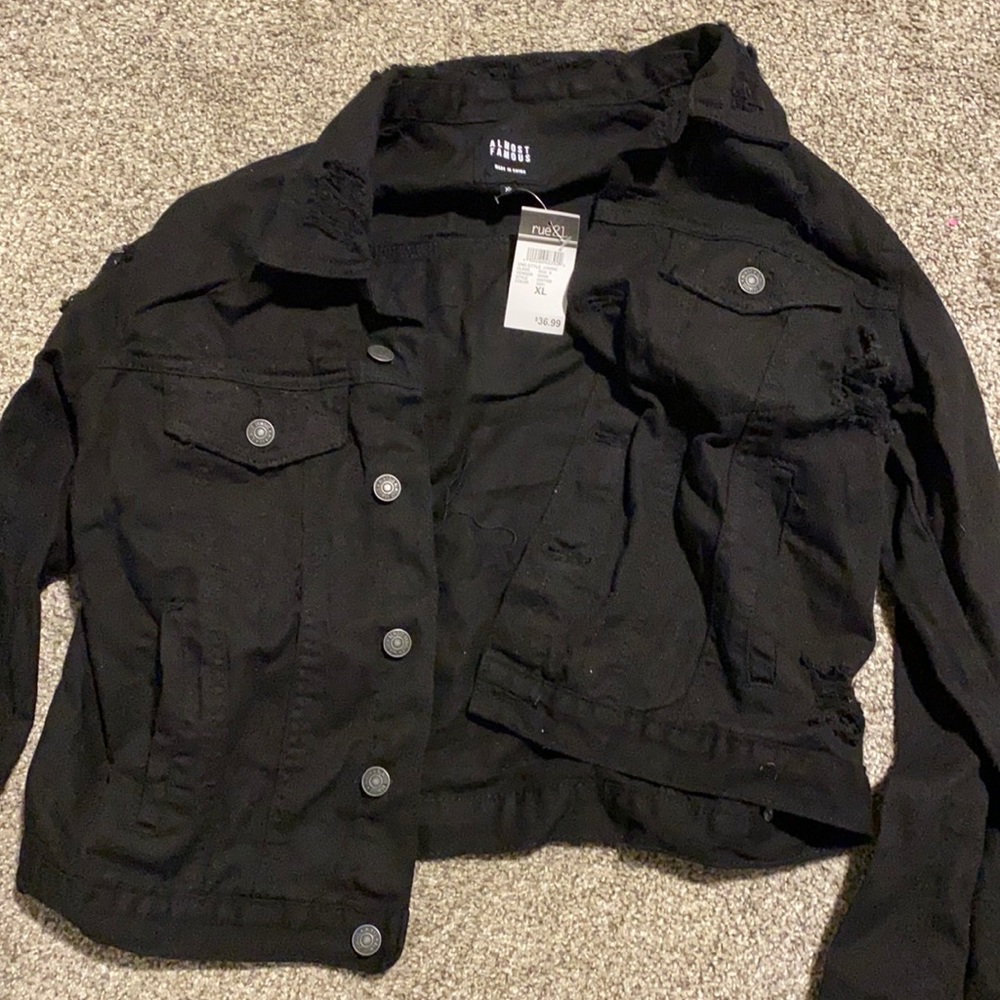 This is a brand new black jean jacket (slightly ripped style),never worn,size XL